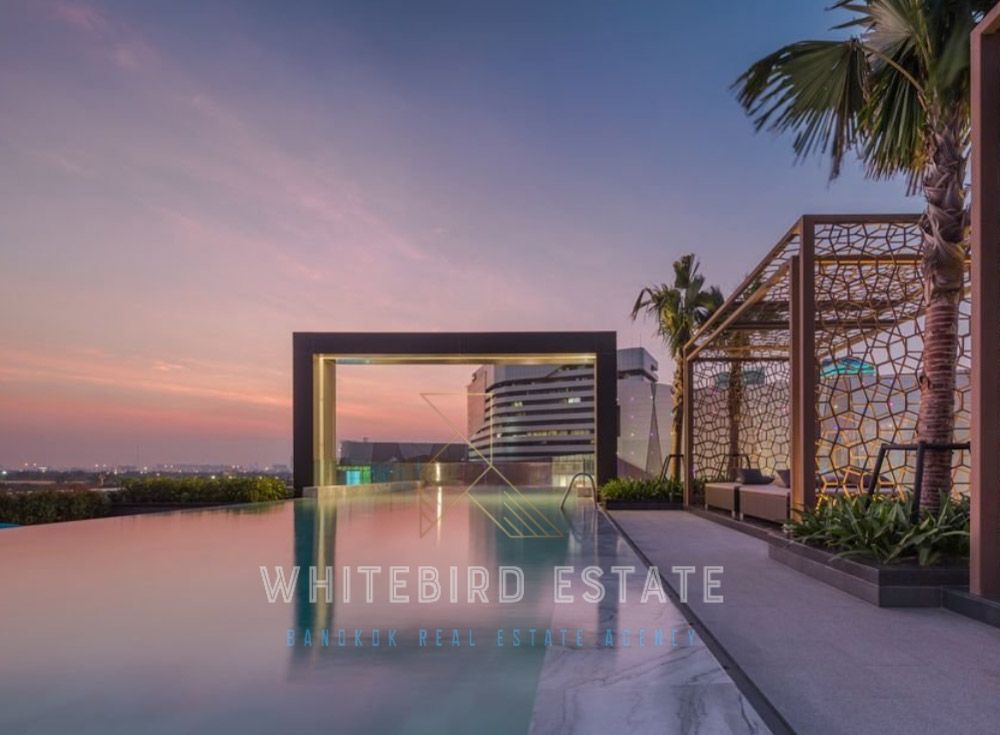 M Ladprao condominium rooftop swimming pool at sunset, Bangkok